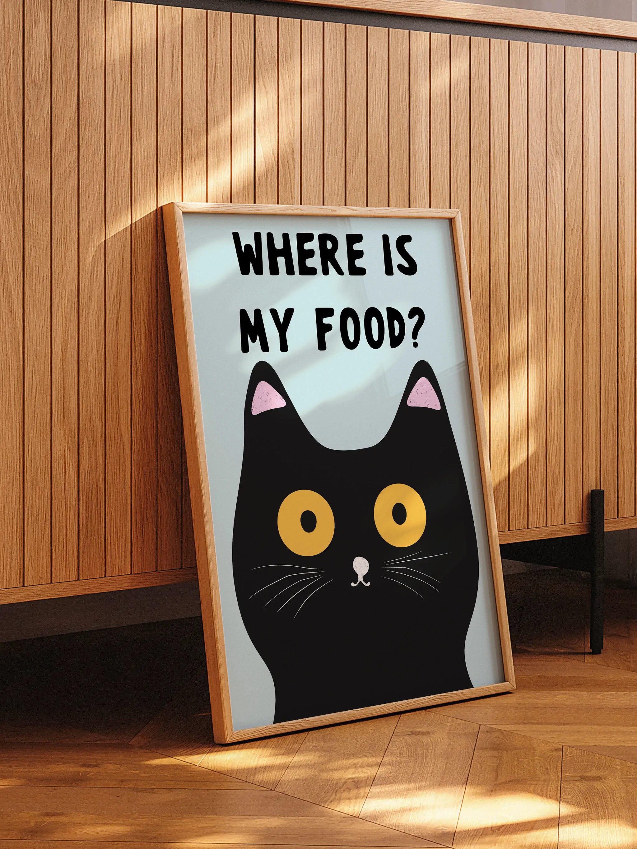 Funny cat-themed wall art featuring a cute black cat looking for food.